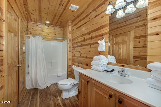 full bathroom with wood-type flooring, toilet, wooden walls, wood ceiling, and vanity