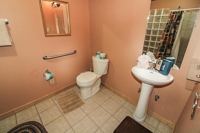 bathroom with toilet and curtained shower