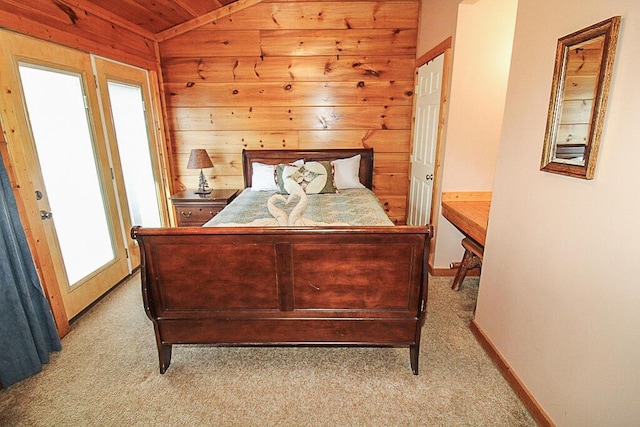 carpeted bedroom with lofted ceiling and wood ceiling