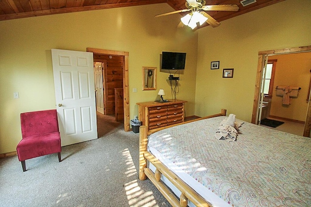 carpeted bedroom featuring vaulted ceiling, ensuite bath, wooden ceiling, and ceiling fan