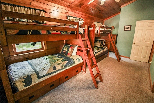 carpeted bedroom with ceiling fan and wooden ceiling