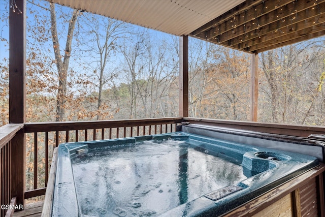 deck with a hot tub