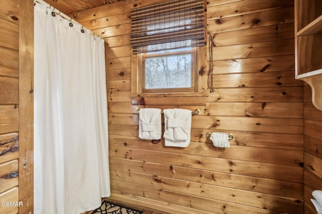 bathroom with wood ceiling and wooden walls