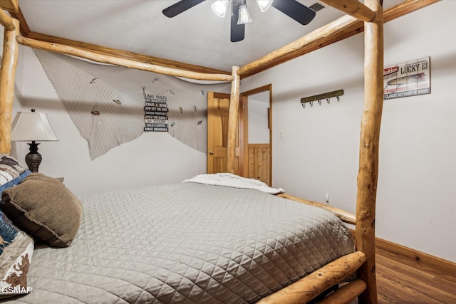 bedroom featuring wood-type flooring and ceiling fan