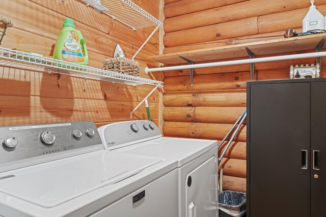 1706 Springer Rd, Sevierville, TN 37862 - laundry area featuring washing machine and clothes dryer, laundry area, and rustic walls