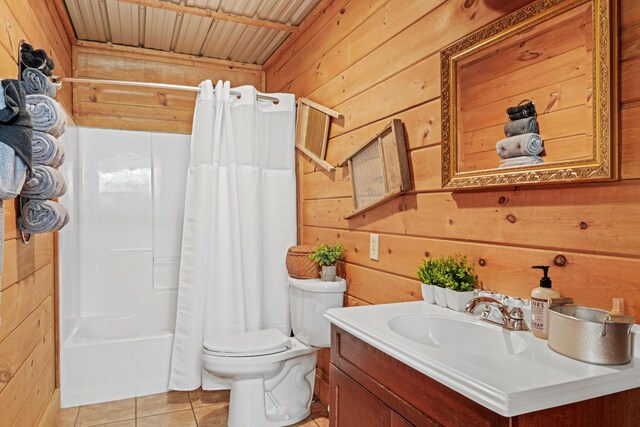 1706 Springer Rd, Sevierville, TN 37862 - full bathroom with vanity, wood walls, toilet, tile patterned floors, and shower / bath combination with curtain