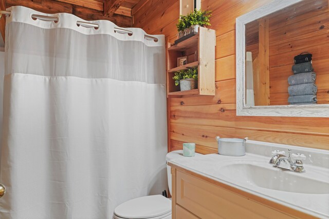 1706 Springer Rd, Sevierville, TN 37862 - full bath featuring toilet, wooden walls, vanity, and a shower with curtain