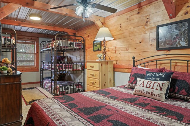 1706 Springer Rd, Sevierville, TN 37862 - bedroom with baseboards, wooden walls, and beam ceiling