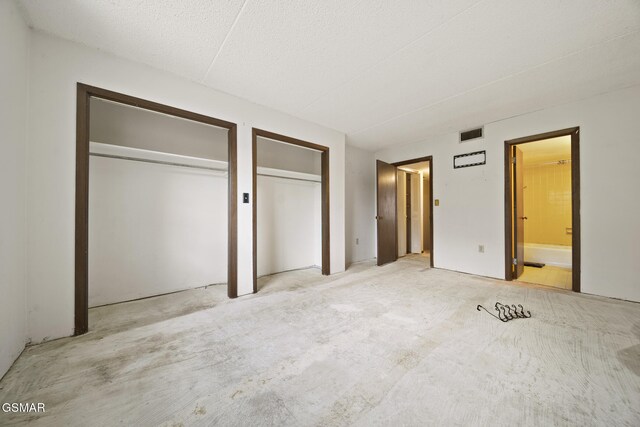 260 Roaring Fork Rd Unit 217, Gatlinburg, TN 37738 - unfurnished bedroom with carpet, connected bathroom, visible vents, and multiple closets