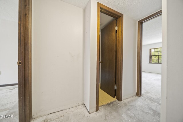 260 Roaring Fork Rd Unit 217, Gatlinburg, TN 37738 - hall featuring a textured ceiling
