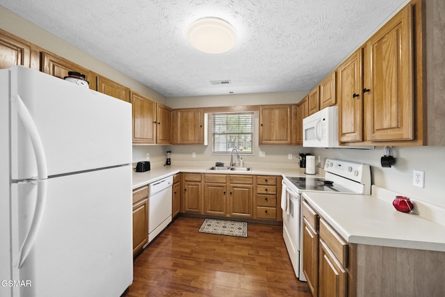 1733 Snapp Rd, Sevierville, TN 37862 - kitchen featuring white appliances, a sink, dark wood-style floors, light countertops, and a textured ceiling
