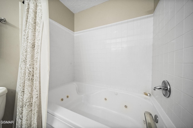 1733 Snapp Rd, Sevierville, TN 37862 - full bath with a combined bath / shower with jetted tub and a textured ceiling