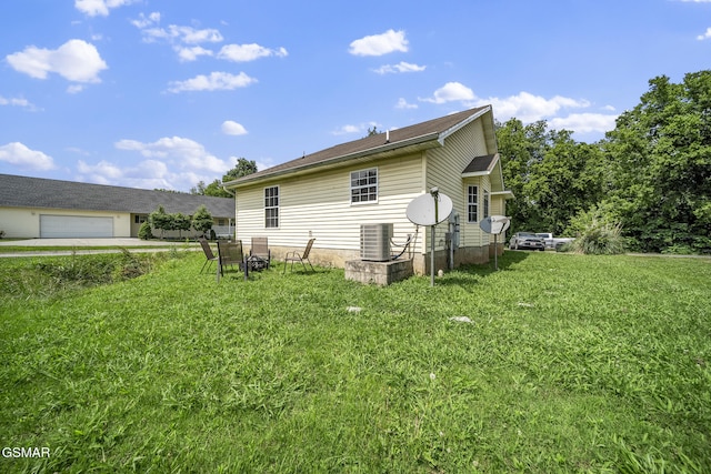 1733 Snapp Rd, Sevierville, TN 37862 - view of home's exterior featuring a yard, central air condition unit, and a garage