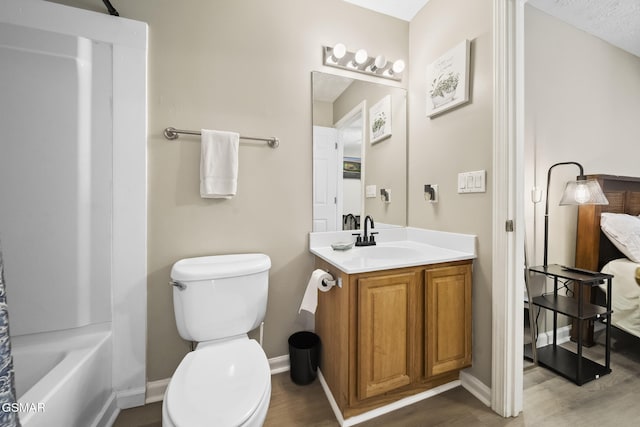 1733 Snapp Rd, Sevierville, TN 37862 - full bathroom with vanity, wood finished floors, toilet, and baseboards