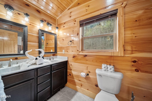 bathroom with wooden ceiling, wood walls, vaulted ceiling, toilet, and vanity