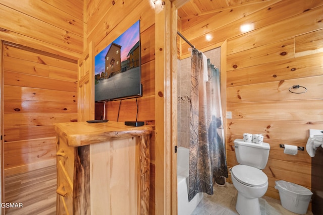 bathroom featuring wood walls, tile patterned flooring, and wooden ceiling