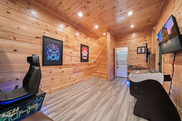 office featuring light wood-type flooring, wood ceiling, and wooden walls