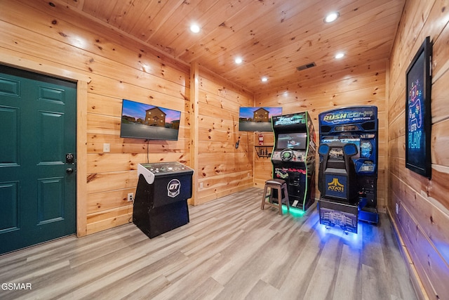 interior space with wood walls, wooden ceiling, and hardwood / wood-style flooring