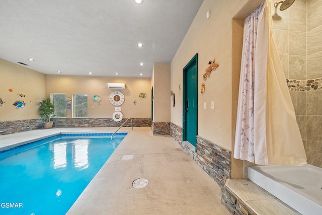 view of pool featuring a wall mounted AC