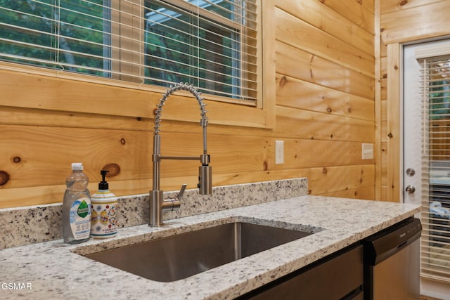 1010 Pinyon Cir, Pigeon Forge, TN 37863 - kitchen featuring stainless steel dishwasher, light stone counters, and tasteful backsplash