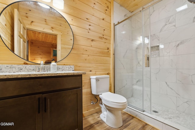 1010 Pinyon Cir, Pigeon Forge, TN 37863 - full bath featuring vanity, a marble finish shower, wood finished floors, and wooden walls