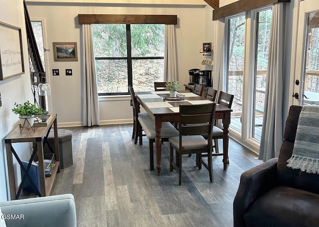 dining room with dark wood finished floors and baseboards