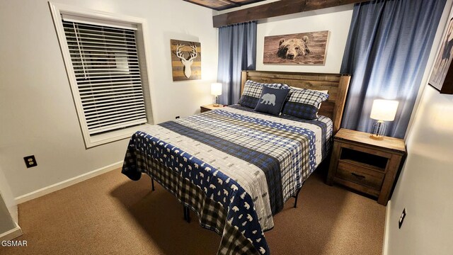 bedroom featuring carpet floors and baseboards