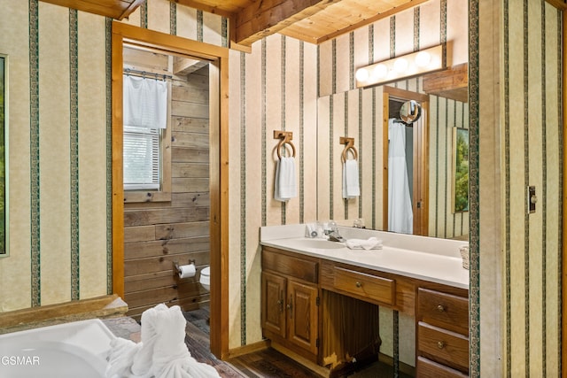 1514 Ridgecrest Dr, Sevierville, TN 37876 - full bath featuring toilet, wallpapered walls, vanity, and wood finished floors