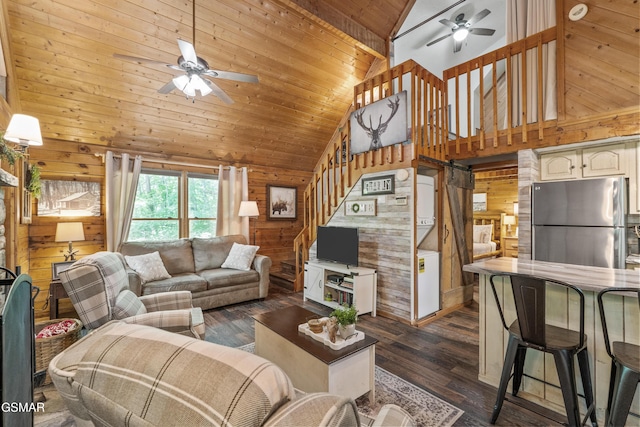 1514 Ridgecrest Dr, Sevierville, TN 37876 - living area with ceiling fan, wood walls, high vaulted ceiling, wooden ceiling, and stairs