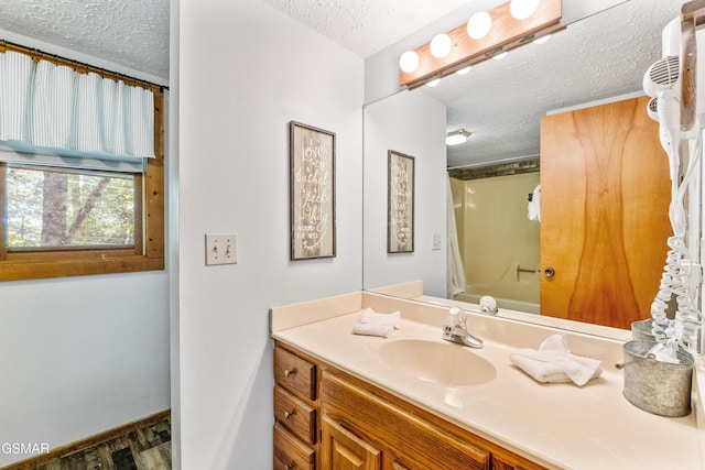 1514 Ridgecrest Dr, Sevierville, TN 37876 - bathroom with a textured ceiling, vanity, and washtub / shower combination