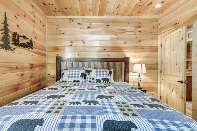 unfurnished bedroom with wooden ceiling and wooden walls