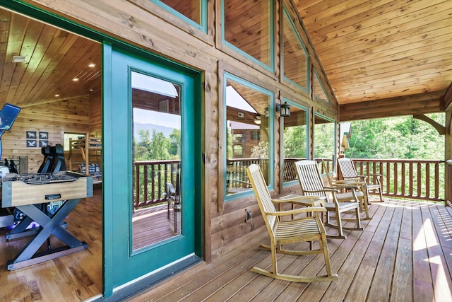 exterior space featuring vaulted ceiling and wooden ceiling