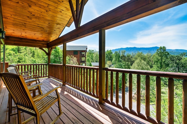 wooden terrace with a mountain view