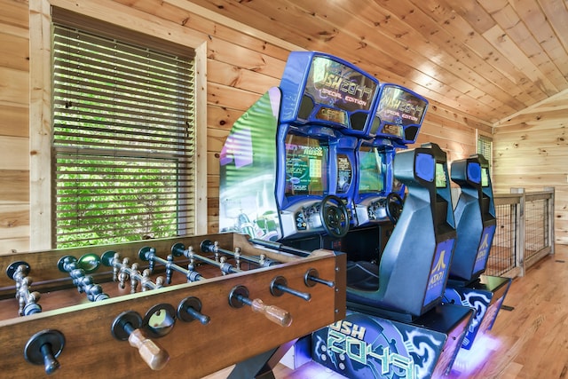 playroom with wood-type flooring, wooden ceiling, vaulted ceiling, and wooden walls