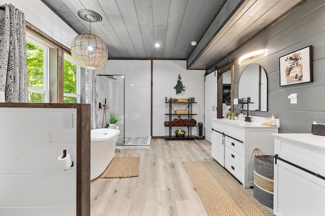441 Matterhorn Dr, Gatlinburg, TN 37738 - bathroom with wood ceiling, hardwood / wood-style floors, vanity, and independent shower and bath