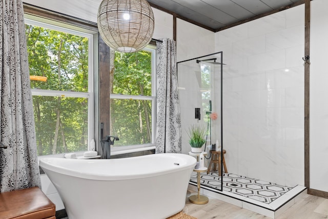 441 Matterhorn Dr, Gatlinburg, TN 37738 - bathroom with separate shower and tub and hardwood / wood-style floors