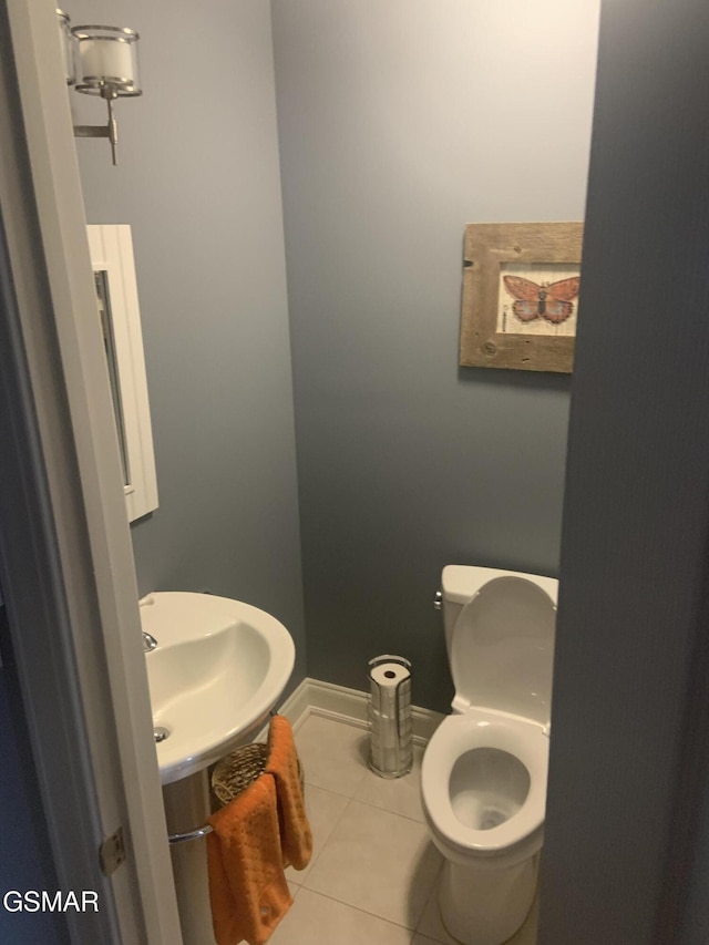 2530 Goingback Cir, Sevierville, TN 37876 - bathroom with tile patterned floors, toilet, a sink, and baseboards
