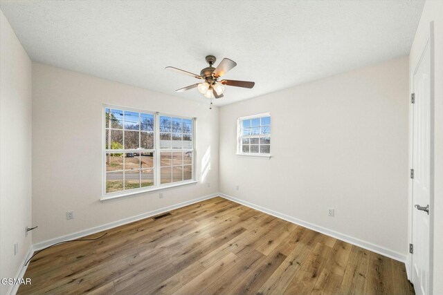 spare room featuring hardwood / wood-style floors