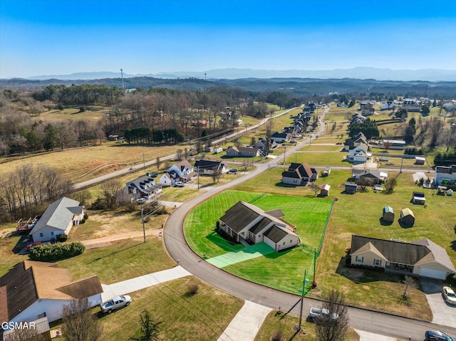 birds eye view of property featuring a mountain view