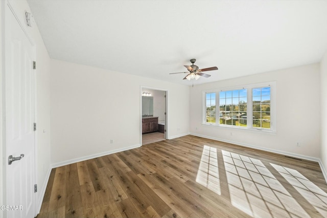 interior space with ceiling fan and hardwood / wood-style floors