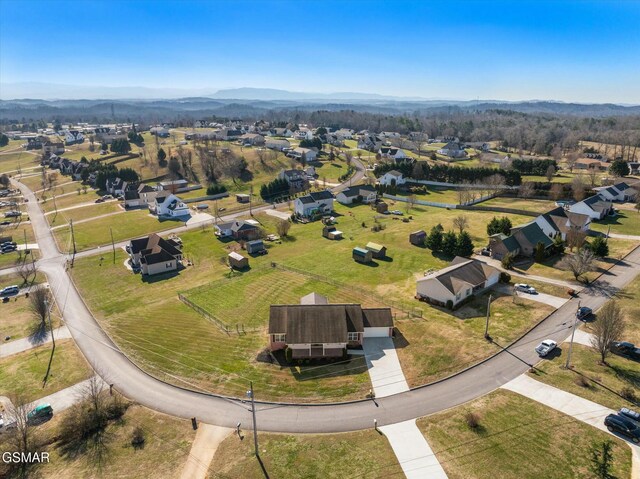 birds eye view of property featuring a mountain view