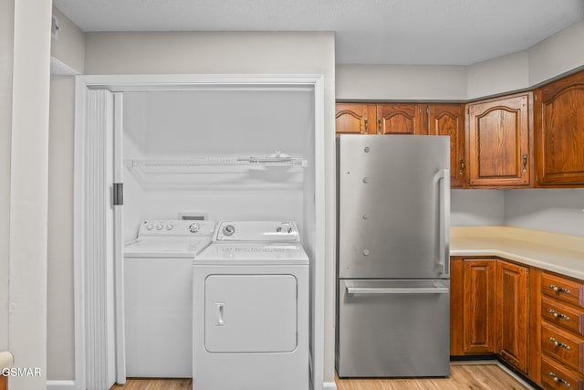 526 Briarcliff Way Apt 102, Pigeon Forge, TN 37863 - laundry area featuring independent washer and dryer and light wood-style floors