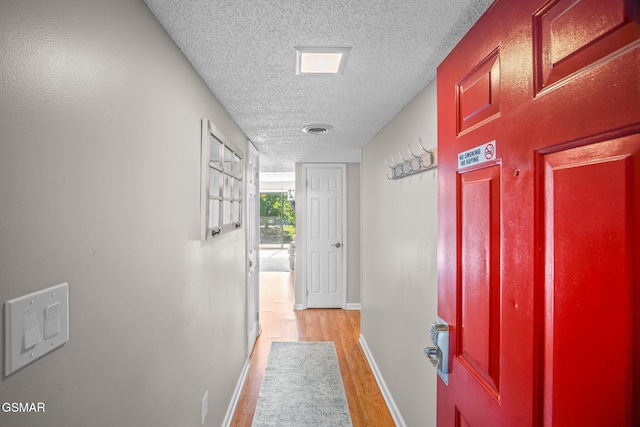 526 Briarcliff Way Apt 102, Pigeon Forge, TN 37863 - corridor featuring a textured ceiling and light wood-type flooring