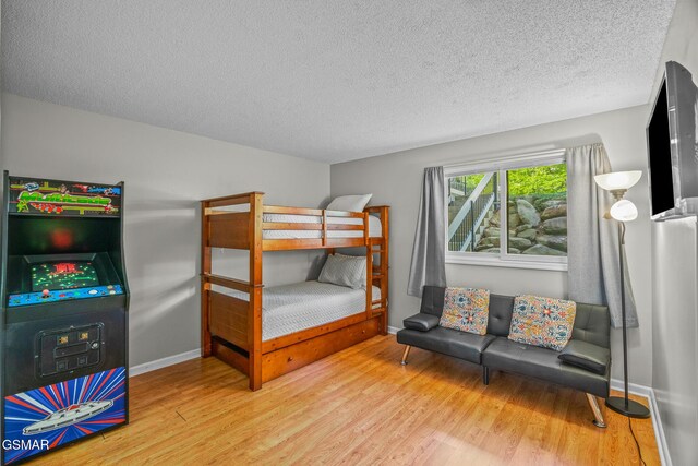 526 Briarcliff Way Apt 102, Pigeon Forge, TN 37863 - bedroom featuring a textured ceiling and wood finished floors