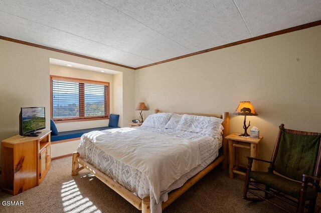 bedroom featuring dark carpet, crown molding, and a textured ceiling