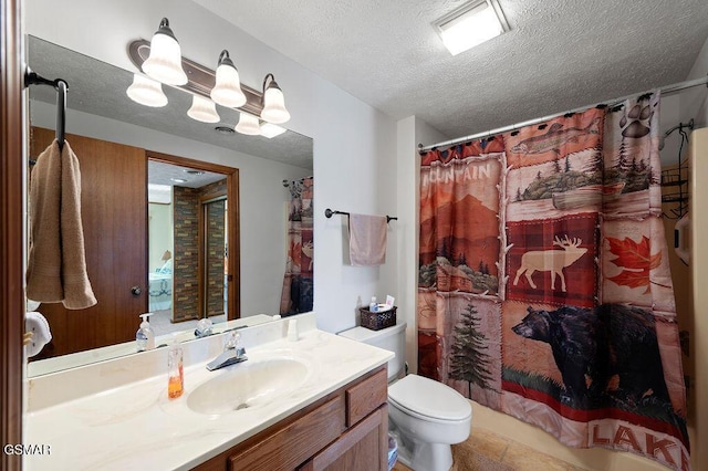 bathroom with vanity, a textured ceiling, toilet, and walk in shower