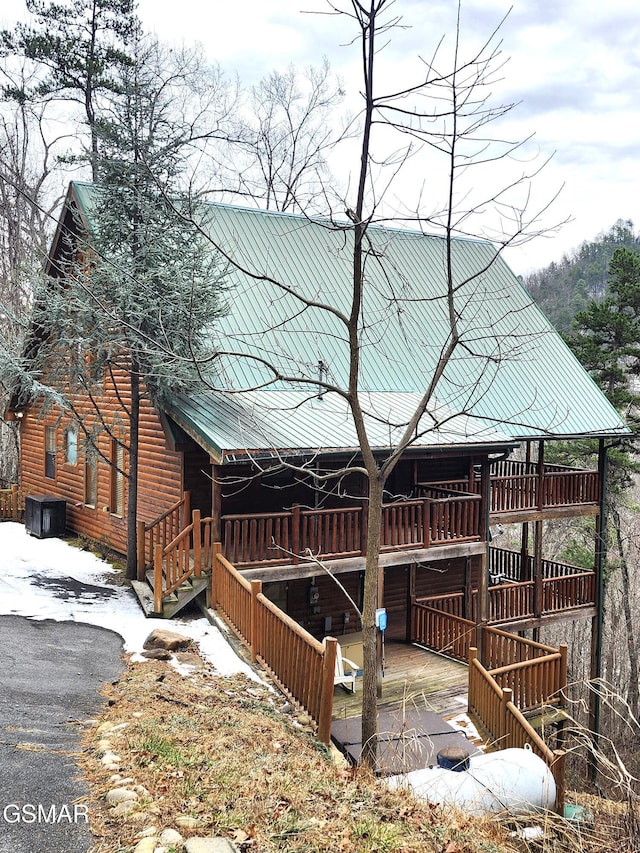 view of property exterior featuring a deck