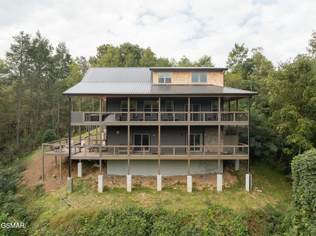 back of property with a wooden deck