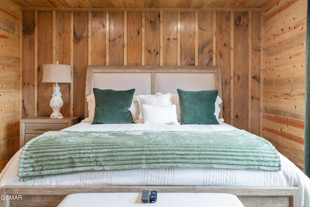 unfurnished bedroom featuring wood ceiling and wood walls