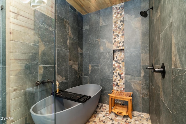 bathroom with tile walls, independent shower and bath, and wood ceiling